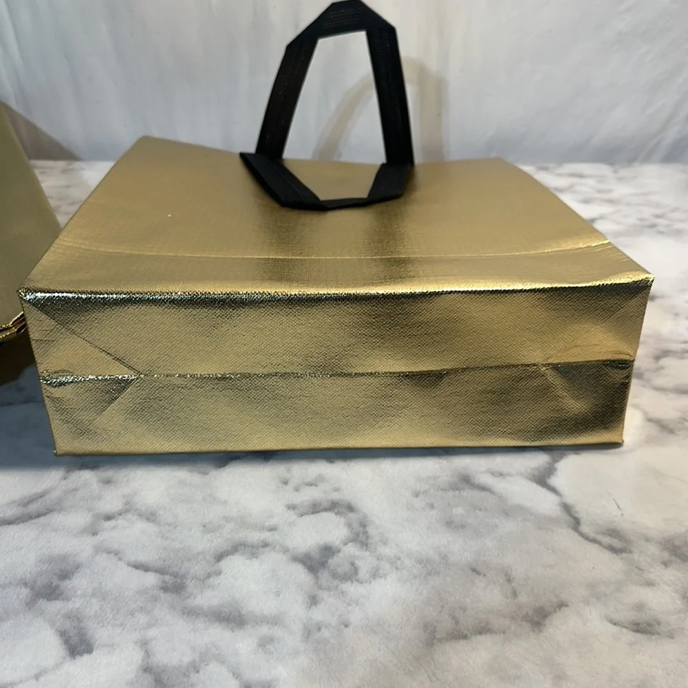 11 Sturdy Reusable Bags with handles in glossy gold.